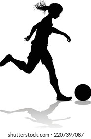 A female soccer football player woman in silhouettes