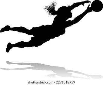 A female soccer football player woman in silhouettes