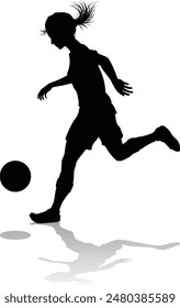 A female soccer football player woman in silhouettes
