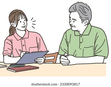 Female staff (caregiver) talking to the elderly
