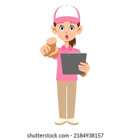 A female staff wearing a short-sleeved polo shirt and a hat pointing to a document