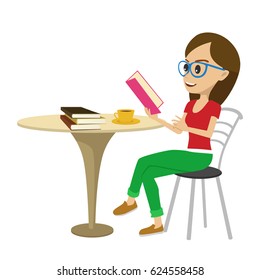 Female student with glasses reading interesting book at table