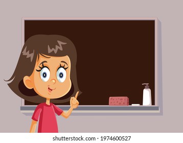 Female Student Standing in Front of a Blackboard. Happy schoolgirl presenting her assignment in class for oral examination project
