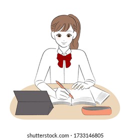 
Female student studying while looking at the tablet