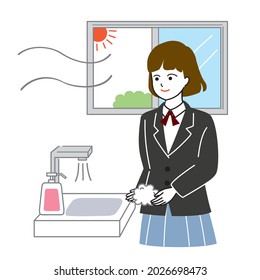 Female student washing hands with a smile 