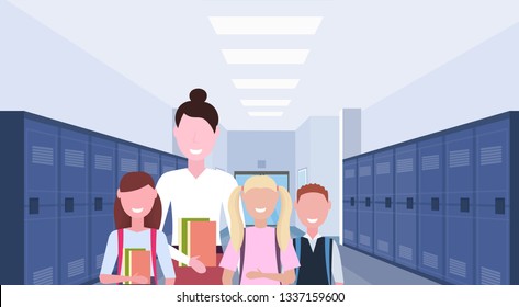 female teacher with schoolchildren group standing in school corridor interior with rows of blue lockers education concept horizontal portrait flat