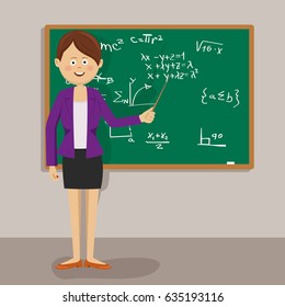 Female teacher standing with pointer next to blackboard in classroom