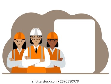 A female team of construction workers in hard hats and orange vests stand near a large white sheet.