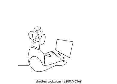 female telemarketing employee wearing headphones at computer