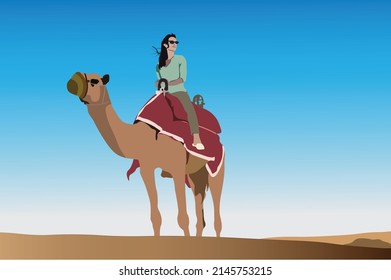 Female tourist riding camel in the desert safari trip at Qatar with blue sky on the background