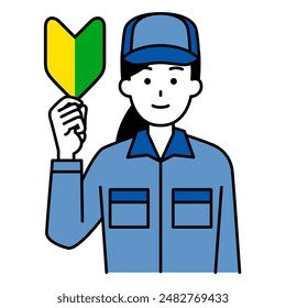 Female worker holding up a beginner's mark