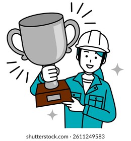 Female worker holding up a silver trophy