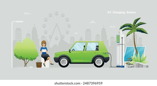 A female worker is using a tablet while waiting to charge an electric car.