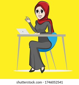 A female worker wearing a red hijab, while working in the office.