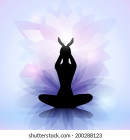 Female yoga silhouette with the lotus flower