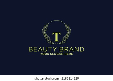 feminine floral letter T. beautiful caligraphic monogram flourish leaf boutique logo vector template stock illustration
