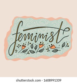 Feminist hand lettering with flowers isolated on white background. Feminist slogan, phrase or quote made in vector. Woman motivational slogan. Inscription for t shirts, posters, cards.