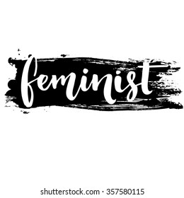 Feminist word, white inscription at black ink stroke. Vector lettering for posters and t shirts