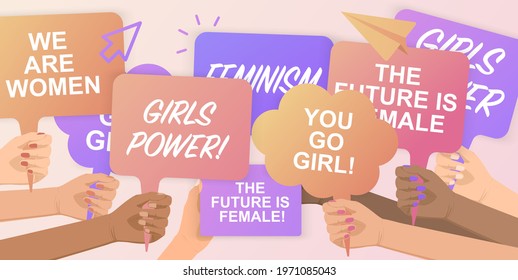 Feminists supporting gender equality with a peaceful rally.Girls Power!Crowd of people protesting for their rights.Holding posters in hands.Hand holding protest poster.Freedom, protest, demonstration.