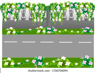 Fence braided by flowers.  Flower beds with flowers along the road