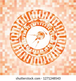 fertilization icon inside abstract emblem, orange mosaic background