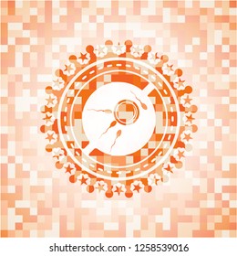 fertilization icon inside abstract orange mosaic emblem