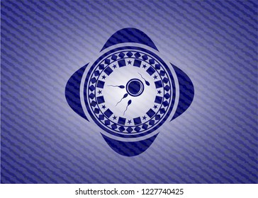 fertilization icon inside badge with denim background