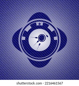 fertilization icon inside badge with denim background. 
