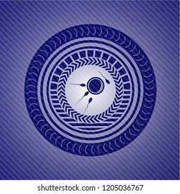 fertilization icon inside badge with jean texture