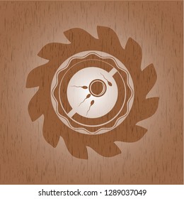 fertilization icon inside badge with wooden background