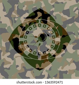 fertilization icon inside camouflage emblem