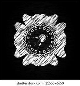 fertilization icon inside chalkboard emblem on black board