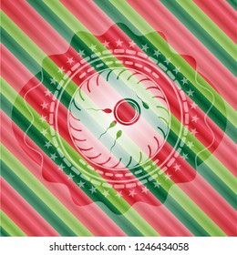 fertilization icon inside christmas colors emblem.