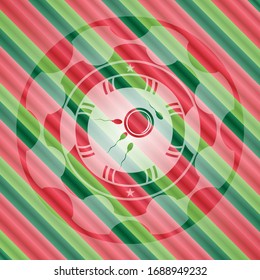 icono de fertilización dentro del emblema del estilo de Navidad.