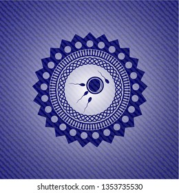 fertilization icon inside emblem with denim high quality background