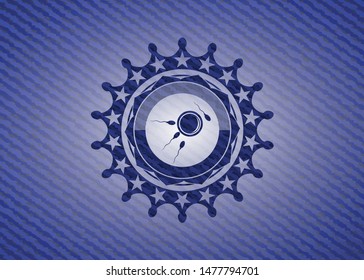 fertilization icon inside emblem with denim texture
