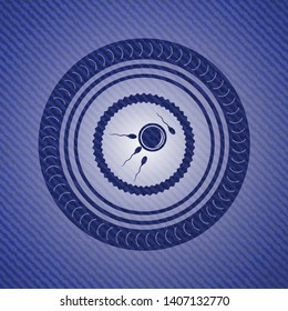fertilization icon inside emblem with jean texture
