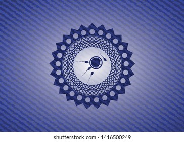 fertilization icon inside emblem with jean texture