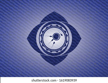 fertilization icon inside emblem with jean background