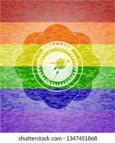 fertilization icon inside emblem on mosaic background with the colors of the LGBT flag