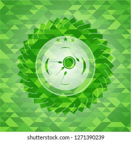 fertilization icon inside green emblem with triangle mosaic background