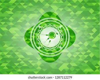 fertilization icon inside green emblem with triangle mosaic background