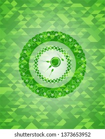 fertilization icon inside green emblem with mosaic background