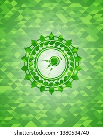fertilization icon inside green emblem with triangle mosaic background