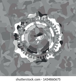 fertilization icon inside grey camouflage texture
