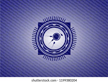fertilization icon inside jean or denim emblem or badge background