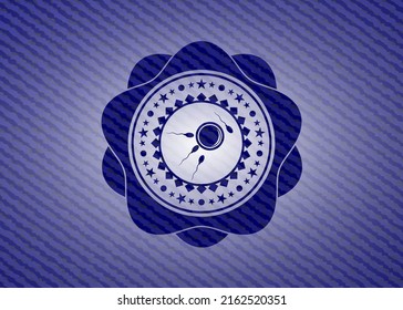 fertilization icon inside jean or denim emblem or badge background. 