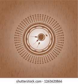 fertilization icon inside wooden emblem. Vintage.