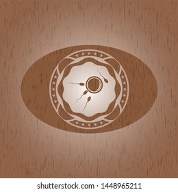 fertilization icon inside wooden emblem
