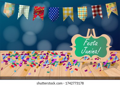 festa junina backdrop with flags and dark background with bright lights and wooden table with colorful confetti and easel